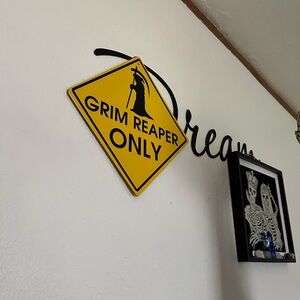 Yellow Grim Reaper Only Wall Sign